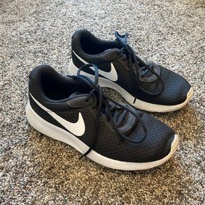 Women’s black Nike running shoes
